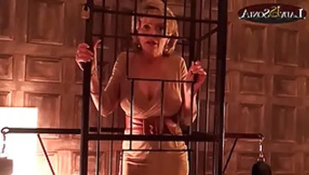 Lady Sonia Is Caged And Strips Nude In The Sex Dungeon