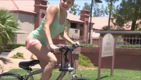 Mindy Rides A Bike To The Park Where She Teases Her Pussy