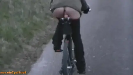 Naughty MILF Rides A Bike Flashing Bare Ass