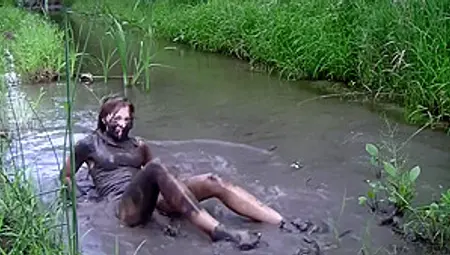 Sexy Blond Girl In Mud