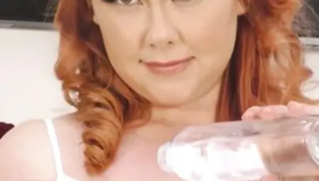 Obese, Golden-haired Woman With Red Hair Is Masturbating With A Glass Sex-toy, On The Floor