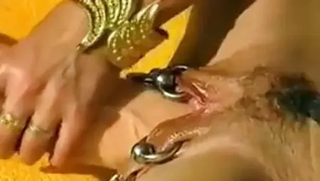 Big Titted Woman With Pierced Nipples And Pussy Is Getting Stuffed With A Massive Dildo
