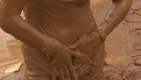 Dirty Girl Is Rubbing Some Mud All Over Her Body
