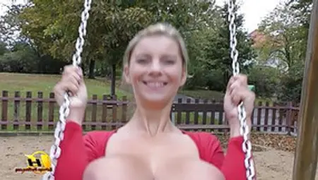 Blonde Woman With Big Tits Is Using The Swing In The Public Park And Being Very Naughty