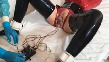 Woman In Latex Receives Electro Treatment In The BDSM Clinic