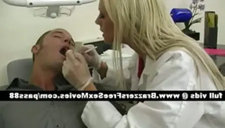 Gorgeousblonde Dentist Looks At A Pacient Mouth