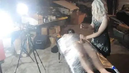 Female Domination Wraps Slave Inside Saran Wrap And Is Slowly Edged