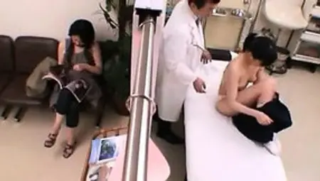 Asian Teen Examined Closely By A Doctor