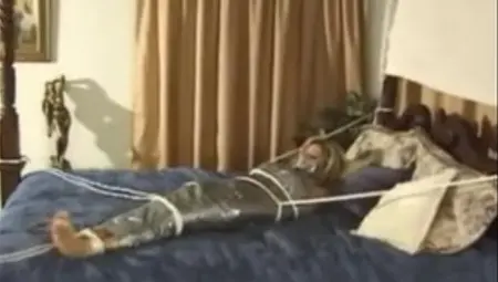 Girl Wrapped In Duct Tape And Roped To Bed