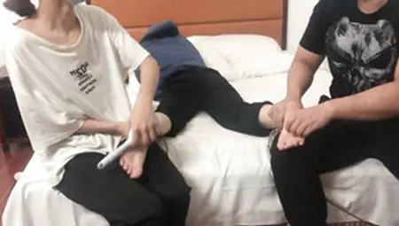 Chinese Girl Is Laughing While These Two Are Tickling Her Feet