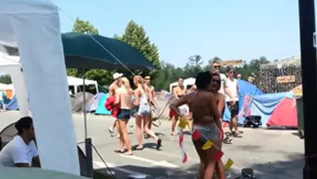 Topless Girl At Festival Tries To Get Her Friend To Join Her Topless