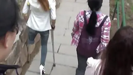 Amputee Chinese Girl Down Stairs With Crutches